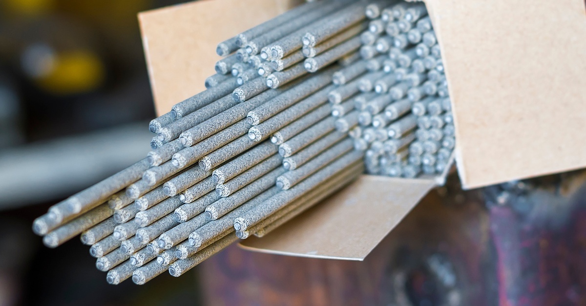 A collection of light gray electrodes with some spilling out of their original box packaging, set on top of another box.